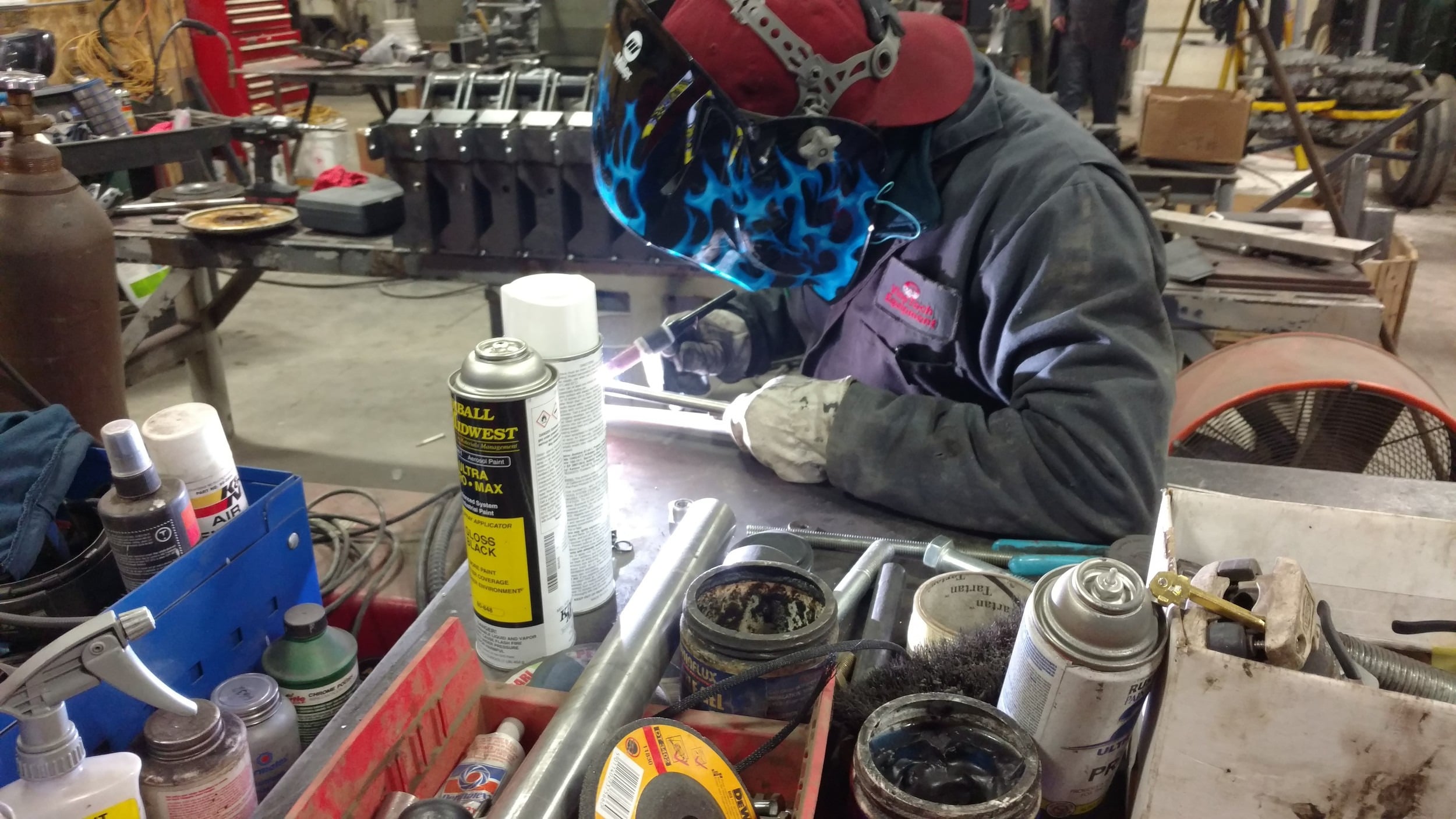 A Vine Tech technician welding in the shop